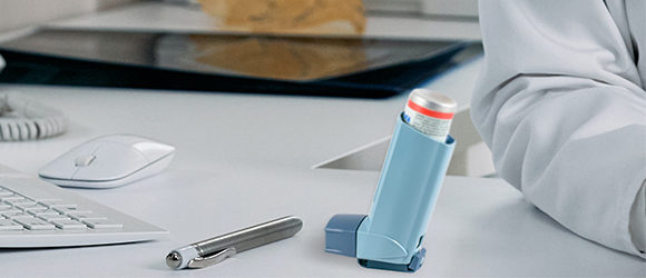 Asthma inhaler on a doctor's desk